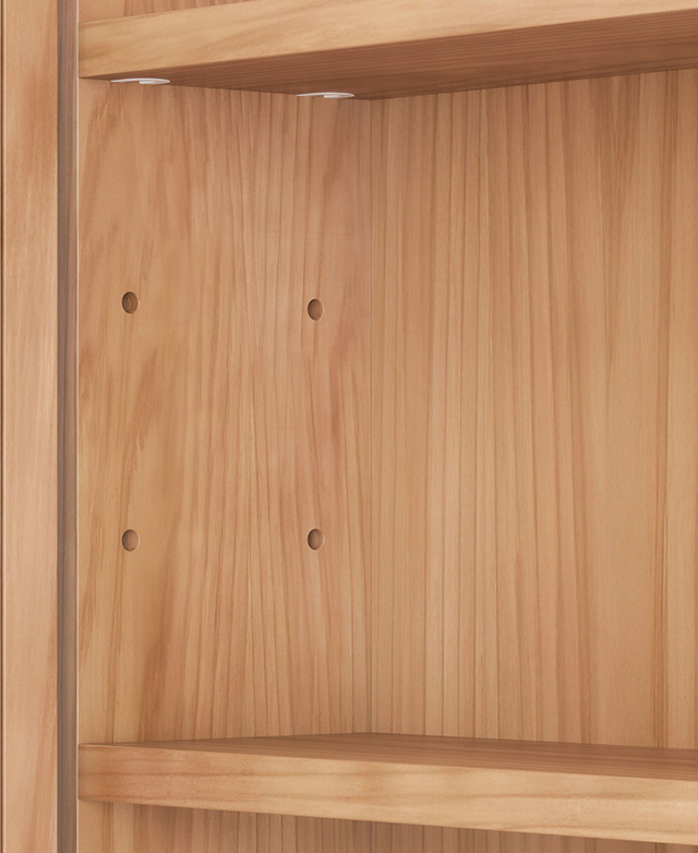 The inner wall of the cabinet is revealed to display pre-drilled holes that allow for shelf adjustability.