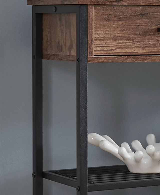 Three-quarter angle zooms in on the metal frame while showing the low shelf with an abstract ceramic on it. Three-quarter angle zooms in on the metal frame while showing the low shelf with an abstract ceramic on it.
