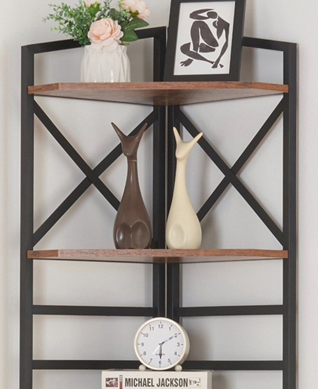 A cropped view of the corner bookshelf highlights the strong, black metal frame. A cropped view of the corner bookshelf highlights the strong, black metal frame.