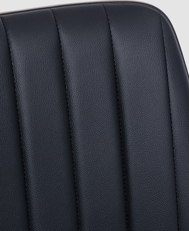 Channel stitching and faux leather upholstery with a subtle pebbled effect. Channel stitching and faux leather upholstery with a subtle pebbled effect.