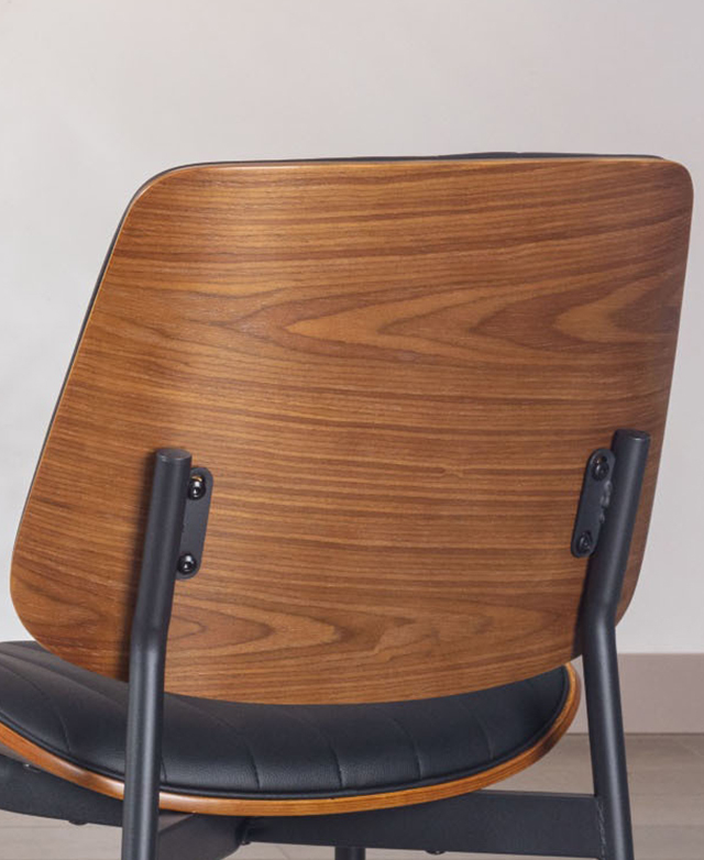 The bentwood backrest from the back angle highlights the chair's mid-century modern shape. The bentwood backrest from the back angle highlights the chair's mid-century modern shape.