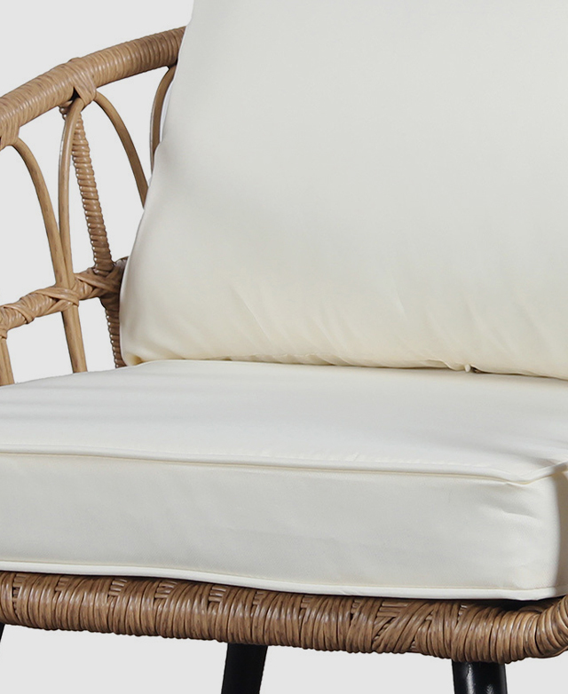 The seat cushion's thick fill is contained in a creamy cover with piping trims. The seat cushion's thick fill is contained in a creamy cover with piping trims.