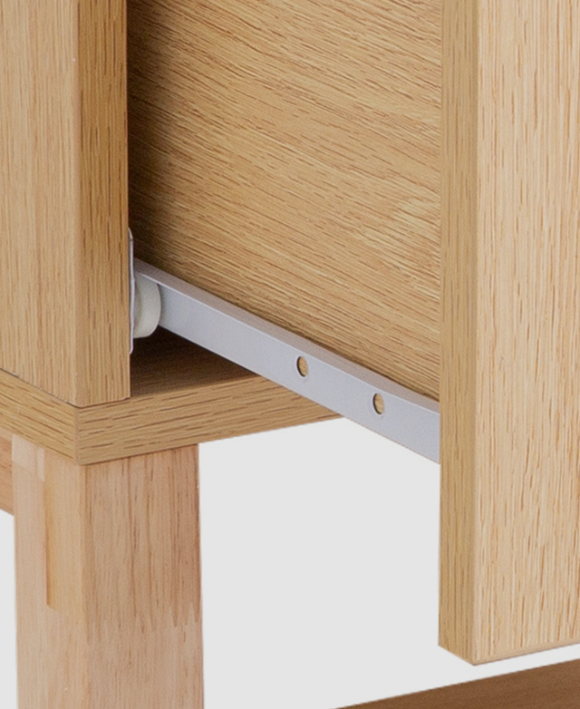 A close-up of the inner side of a drawer to highlight the strong metal runner.