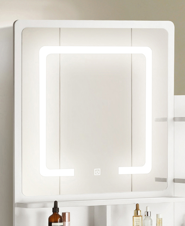 A square-shaped mirror with rounded corners features an integrated LED trim, which is illuminated.