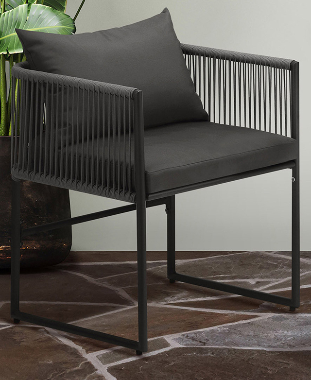 Positioned on the rich-coloured tiled ground, the chair's minimalist metal frame is sharply in focus. Positioned on the rich-coloured tiled ground, the chair's minimalist metal frame is sharply in focus.