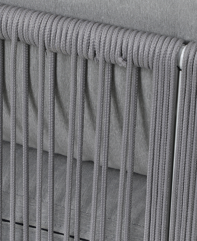 A close-up of the chair highlights the polyester rope that is wrapped around the frame; cushioning is shown behind. A close-up of the chair highlights the polyester rope that is wrapped around the frame; cushioning is shown behind.