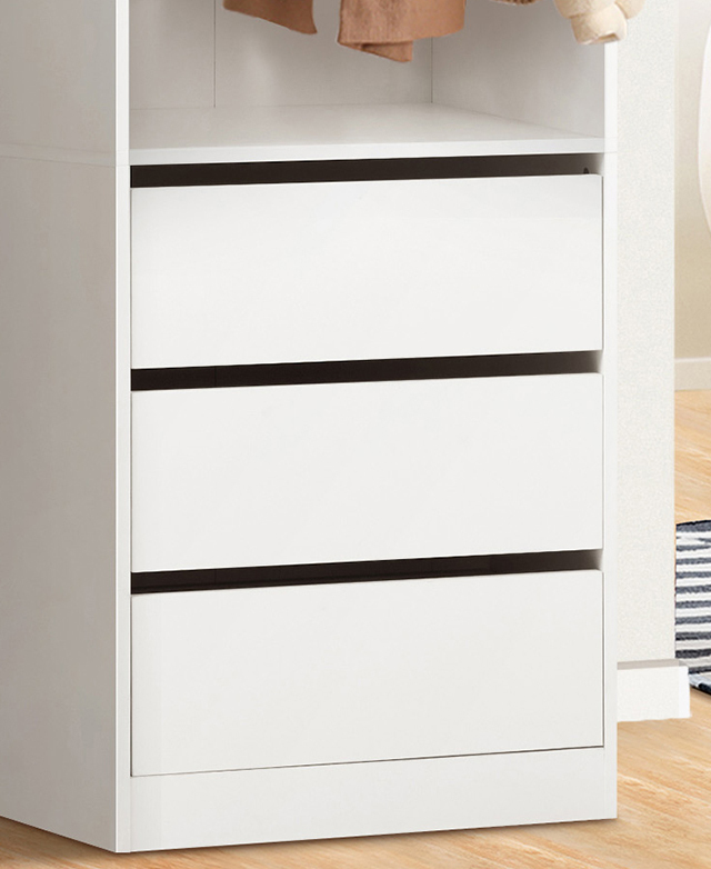 Lower half of the white wardribe displays three drawers with clean lines and a minimalist finish.