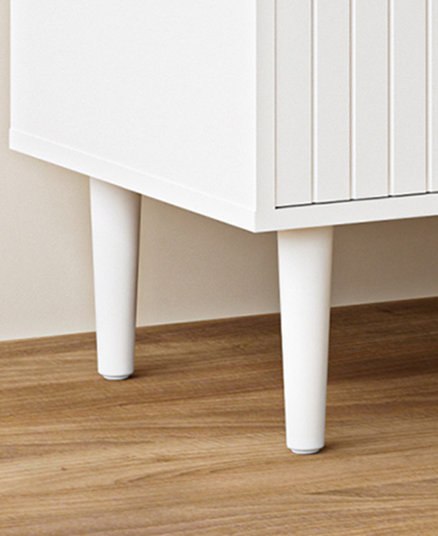 Tapered, white eucalyptus legs are shown up close to demonstrate their modern style. Tapered, white eucalyptus legs are shown up close to demonstrate their modern style.
