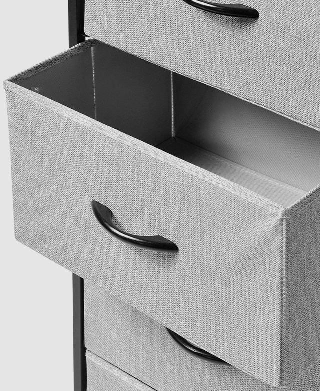 A three-quarter angle shows an open middle fabric drawer, with a smooth black handle and metal frame discernable.