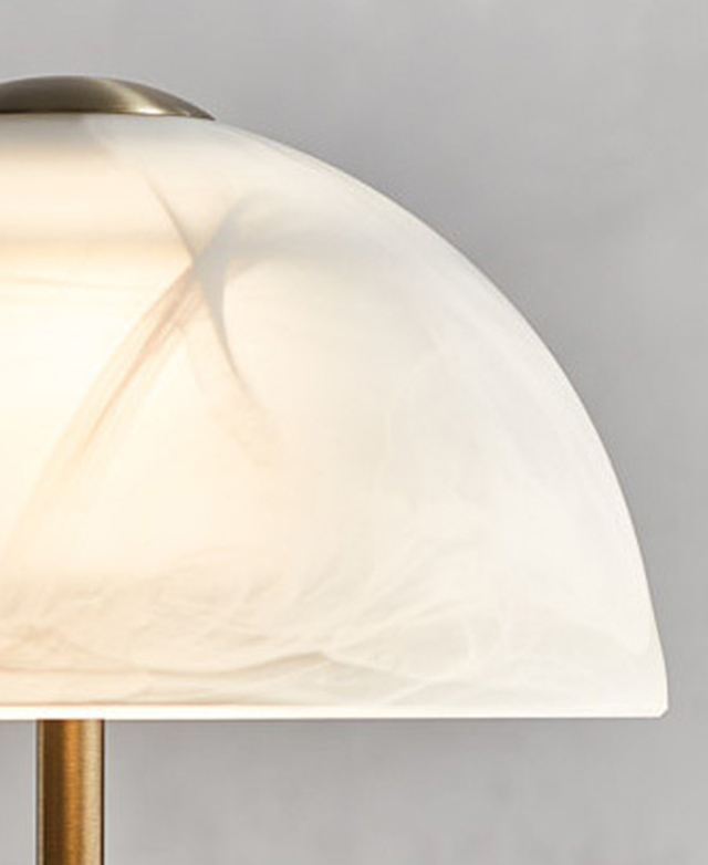 The dome-shaped frosted glass shade is shown close up so the marbled effect is in focus. The dome-shaped frosted glass shade is shown close up so the marbled effect is in focus.