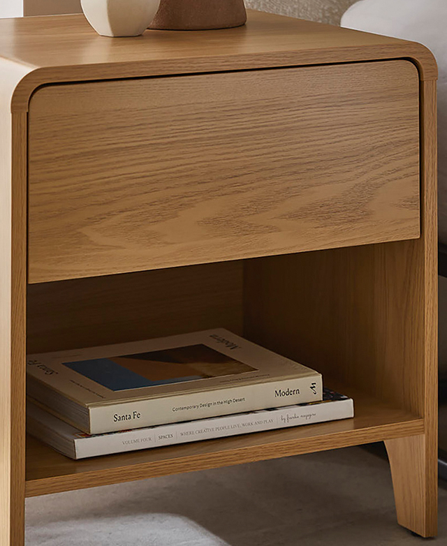 The side table is shown at an angle to highlight its generous width; the low shelf has two books stacked on it. The side table is shown at an angle to highlight its generous width; the low shelf has two books stacked on it.