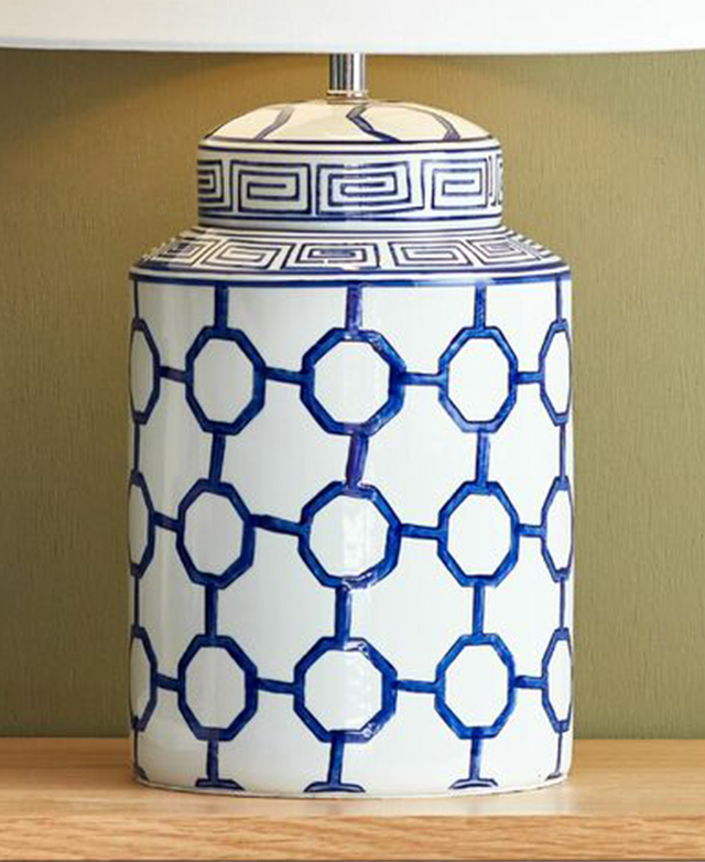 A close-up of the blue and white ceramic lamp base shows off its polished finish. A close-up of the blue and white ceramic lamp base shows off its polished finish.