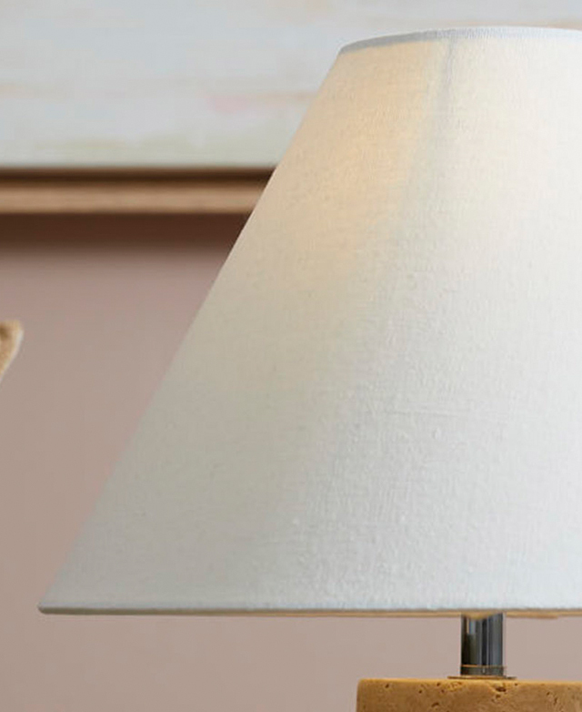 White, linen-look polyester forms the lamp's empire shade. White, linen-look polyester forms the lamp's empire shade.