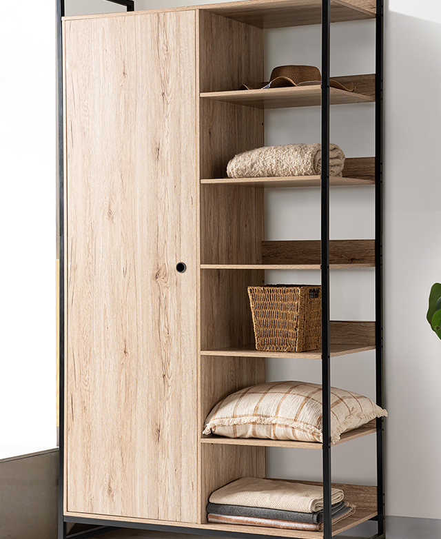 An almost-full view of the black wardrobe shows the cupboard area and the open shelves with items arranged on them. An almost-full view of the black wardrobe shows the cupboard area and the open shelves with items arranged on them.