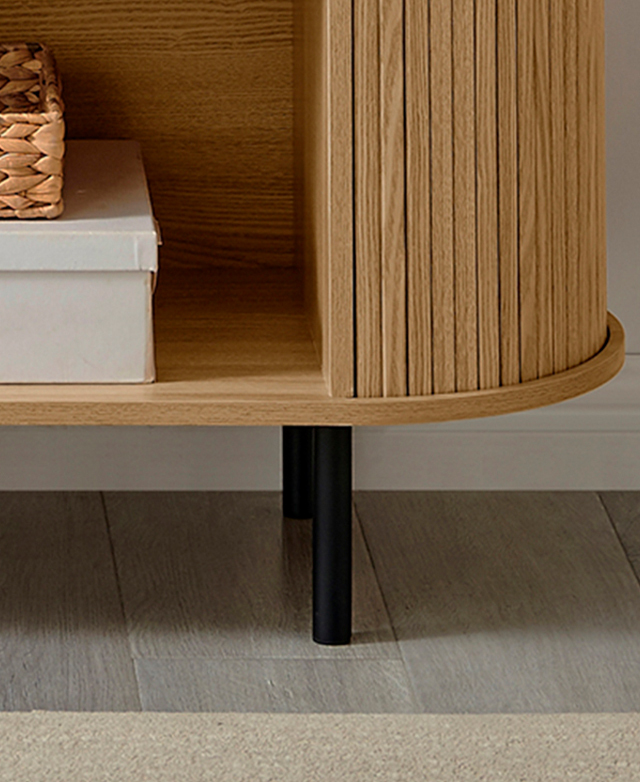 Black metal legs at one end are zoomed in on to highlight the neat, floating effect of the sideboard. Black metal legs at one end are zoomed in on to highlight the neat, floating effect of the sideboard.