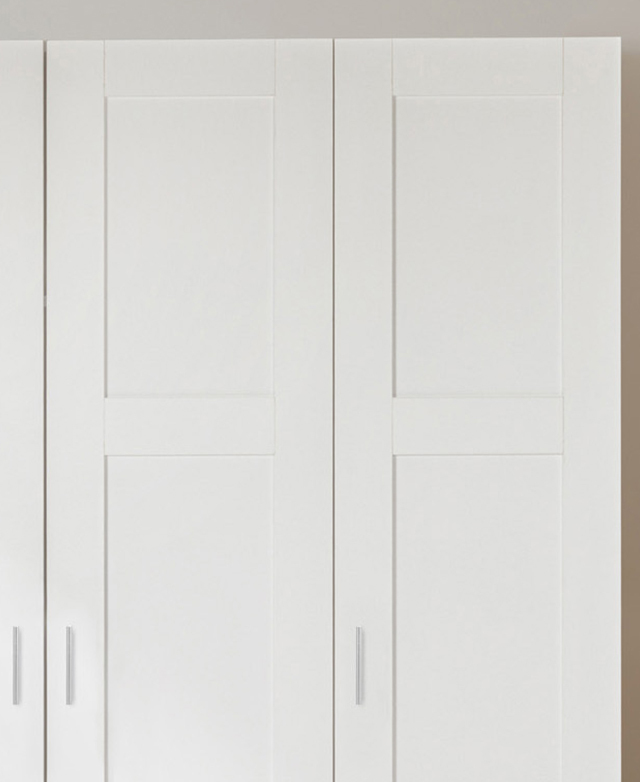 Cropped view shows the panelled detail of the white shaker-style cupboard fronts. Cropped view shows the panelled detail of the white shaker-style cupboard fronts.