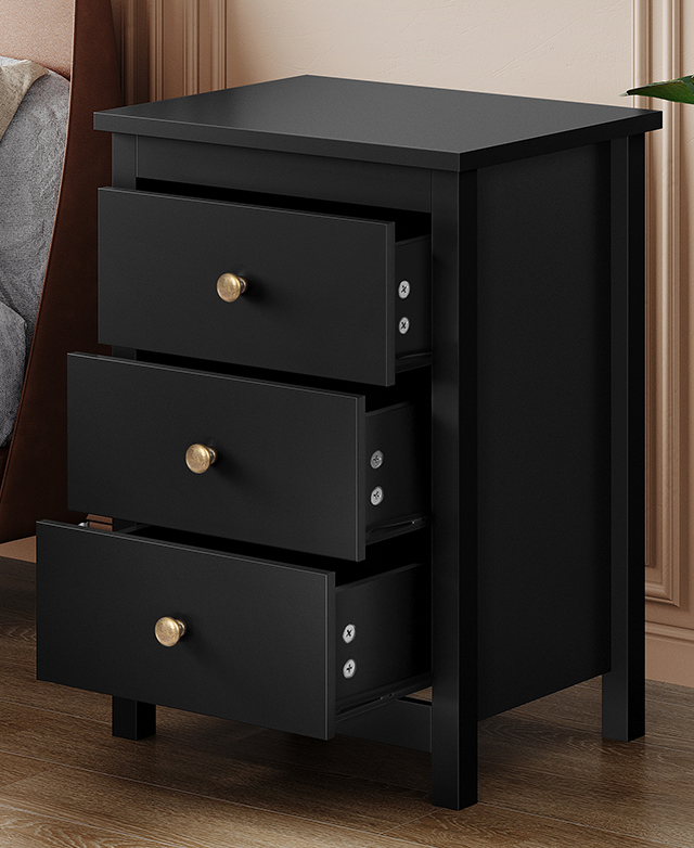 Side table shown at an angle with all three black drawers slightly open. Side table shown at an angle with all three black drawers slightly open.