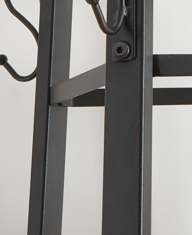 The black steel frame is shown close up to show its hard lines and the hanging hooks at the end. The black steel frame is shown close up to show its hard lines and the hanging hooks at the end.