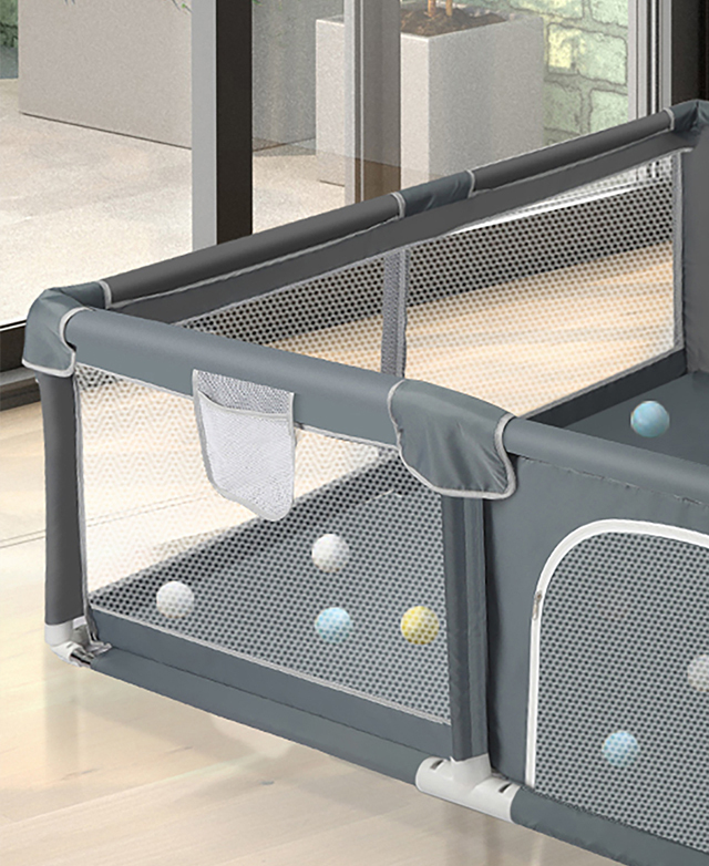 Mesh fabric makes up the walls of a child-safe playpen. Mesh fabric makes up the walls of a child-safe playpen.