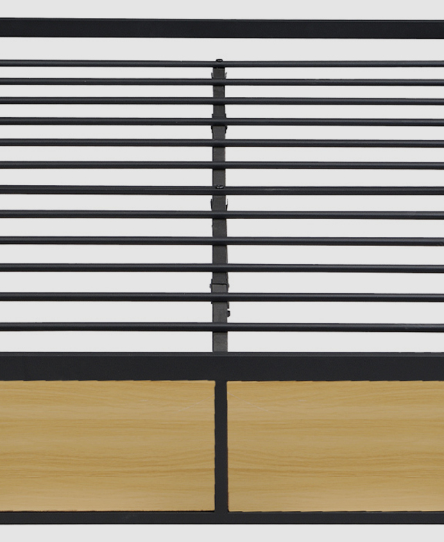 Focus is on the bed's slatting, which is made of metal and features spacing between the metal tubes.