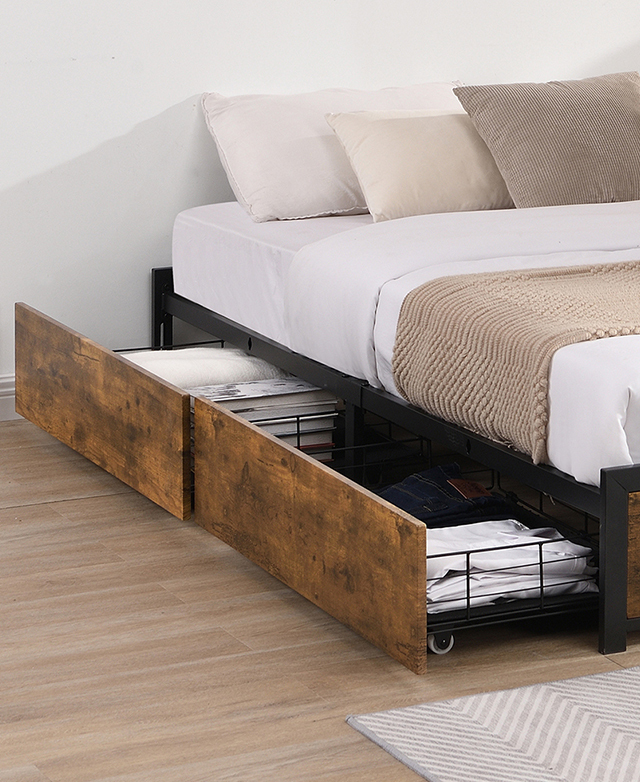Two timber-front side drawers that are filled with folded clothes are pulled out beneath the dressed bed.