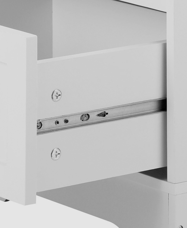 A white drawer is open to reveal a silver metal runner. A white drawer is open to reveal a silver metal runner.