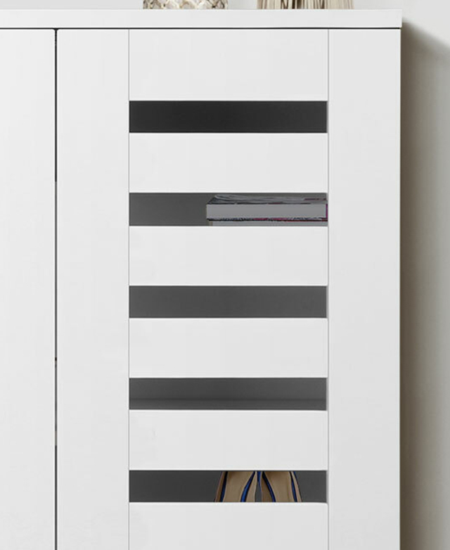 A white slatted cupboard door is closed, with items on the inner shelves just seen through the gaps.