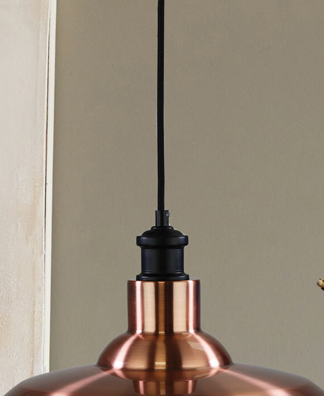 The finial of the copper pendant light has a brushed finish.