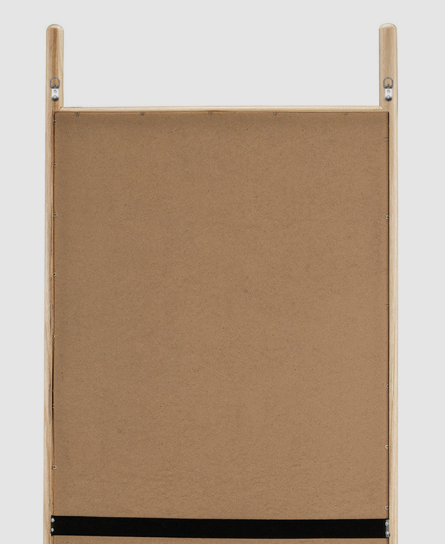 The back of the mirror highlights the metal hooks for hanging.