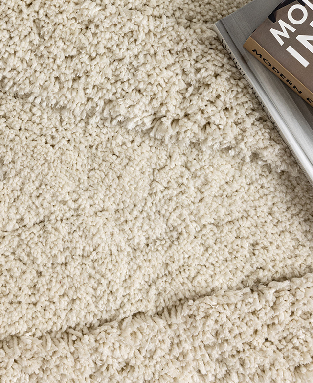 Close bird's eye view of the cream rug emphasises the fine fibres and their tufted effect. Close bird's eye view of the cream rug emphasises the fine fibres and their tufted effect.