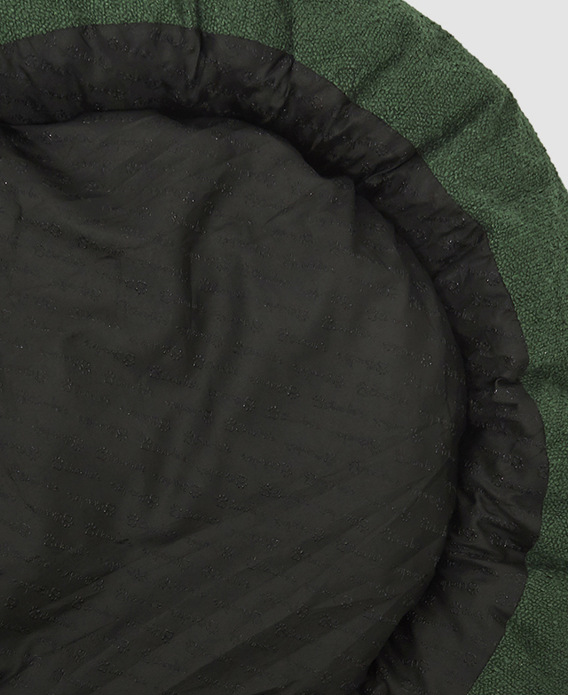 The underside of the dog bed, which is black waterproof thermoplastic polyurethane, is shown. The underside of the dog bed, which is black waterproof thermoplastic polyurethane, is shown.