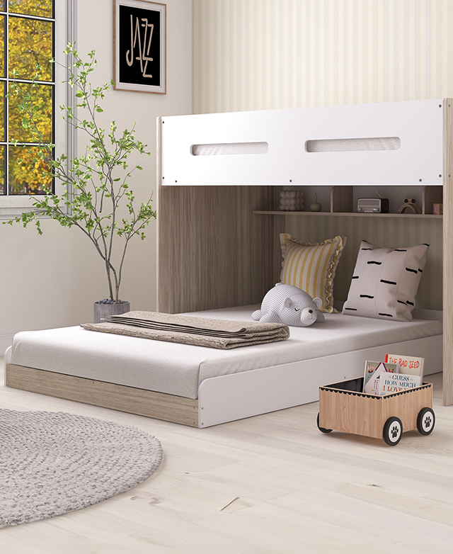 The white bunk bed is assembled in a bright room, with the low bunk perpendicular to the frame.