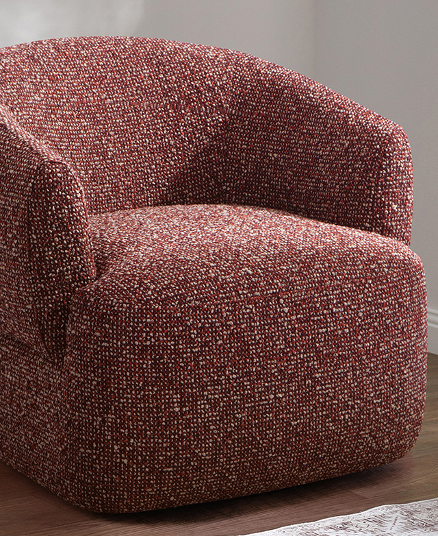 The merlot armchair is presented at a slight angle in a brightly-lit room. The merlot armchair is presented at a slight angle in a brightly-lit room.