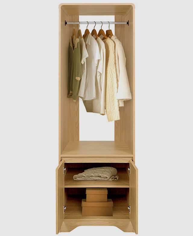 The narrow open wardrobe features clothes hanging on the metal rail, and a blanket and boxes on the bottom shelves. The narrow open wardrobe features clothes hanging on the metal rail, and a blanket and boxes on the bottom shelves.