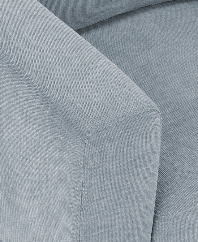 Close bird's eye view of the light blue premium Warwick upholstery fabric.