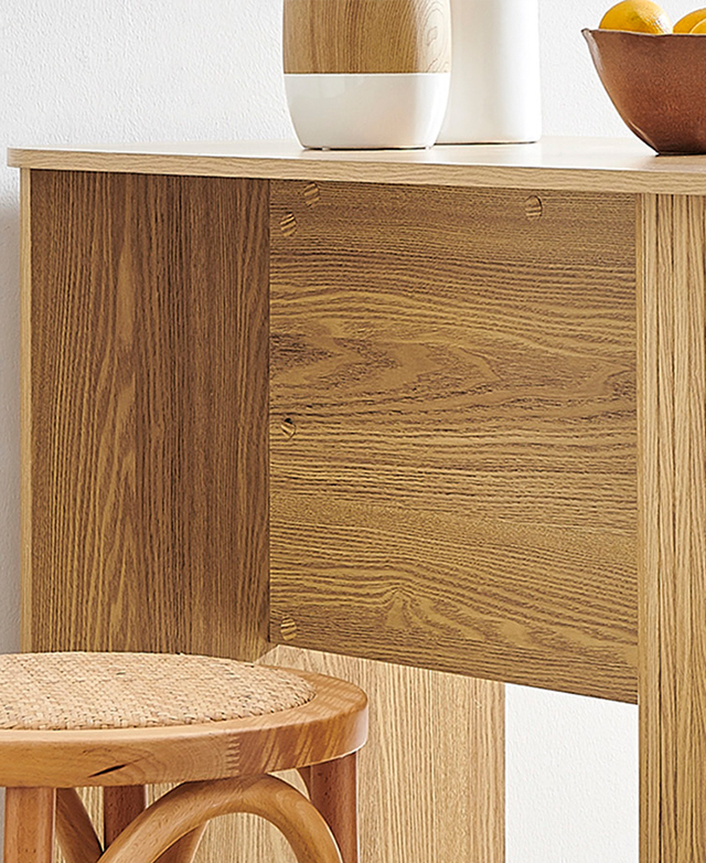 A side view of the bar table displays the support panel and the wood grain-effect of the laminate finishes.