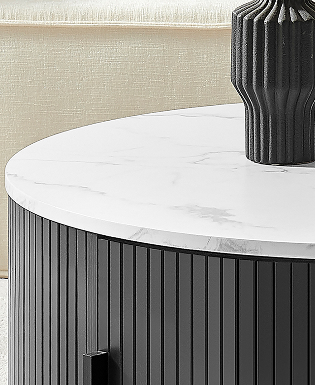 The top of the round coffee table is magnified to highlight the marble-effect top.