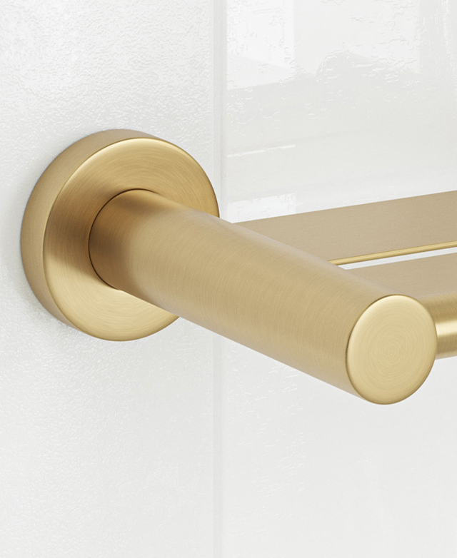 Brushed gold with shelf, round wall mount close-up on white tiles.