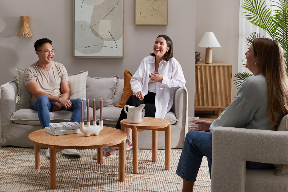 3 people sitting and laughing in Living Room social setting lifestyle image